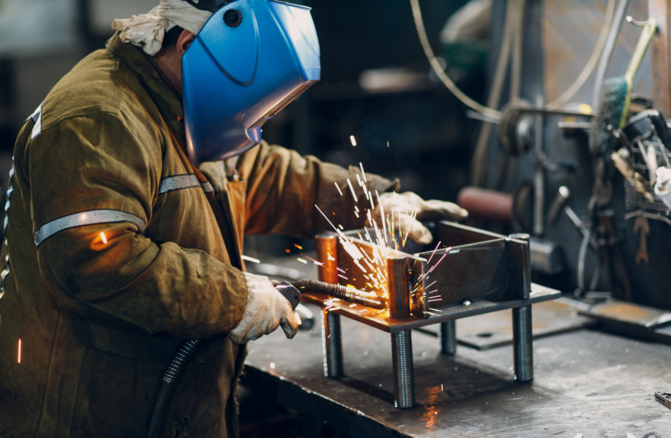 Welder with hard hat welding stainless steel